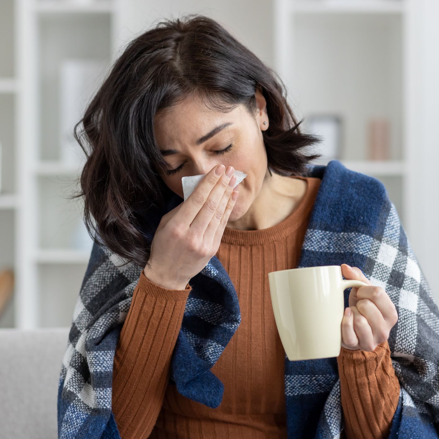 woman who can't stop sneezing