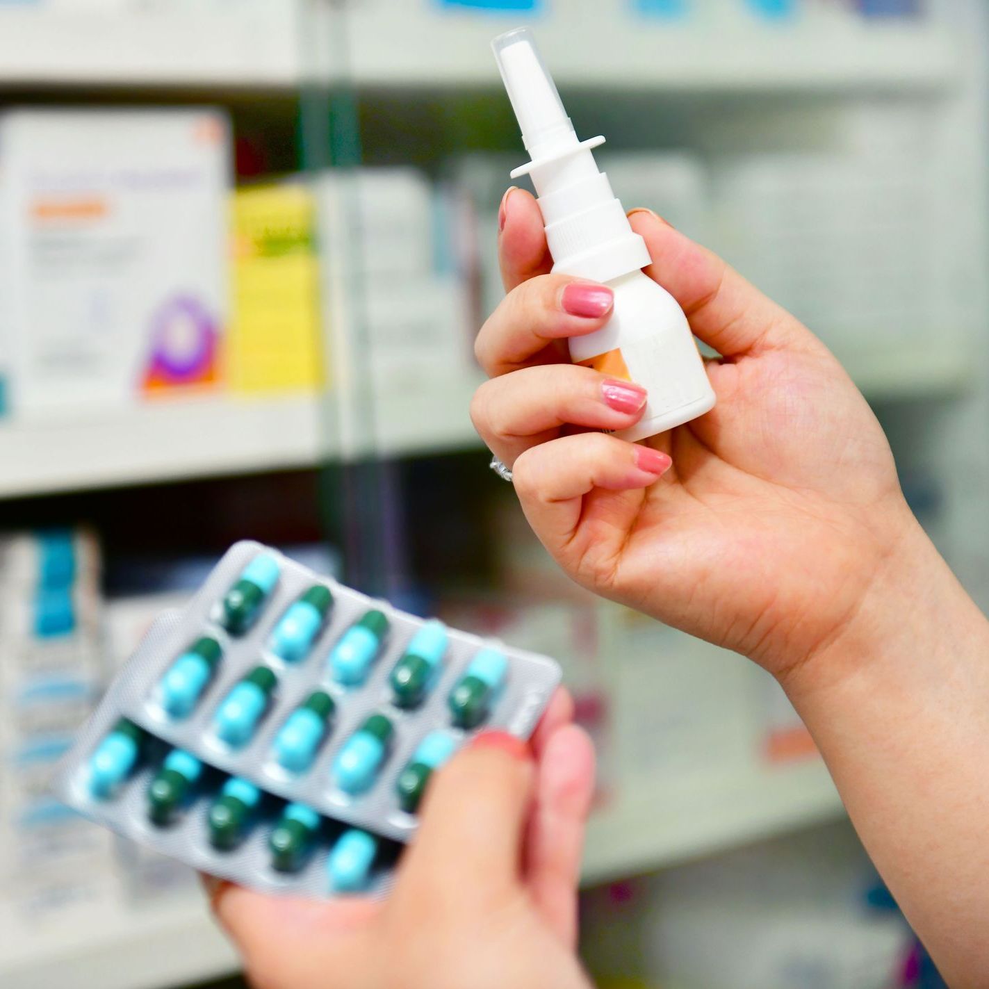 woman comparing medicine for allergy cough